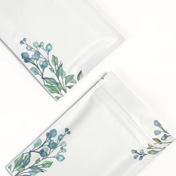 [SAMPLE] 70mm x 100mm White with Green/Blue Flower Matt 3 Side Seal Bags